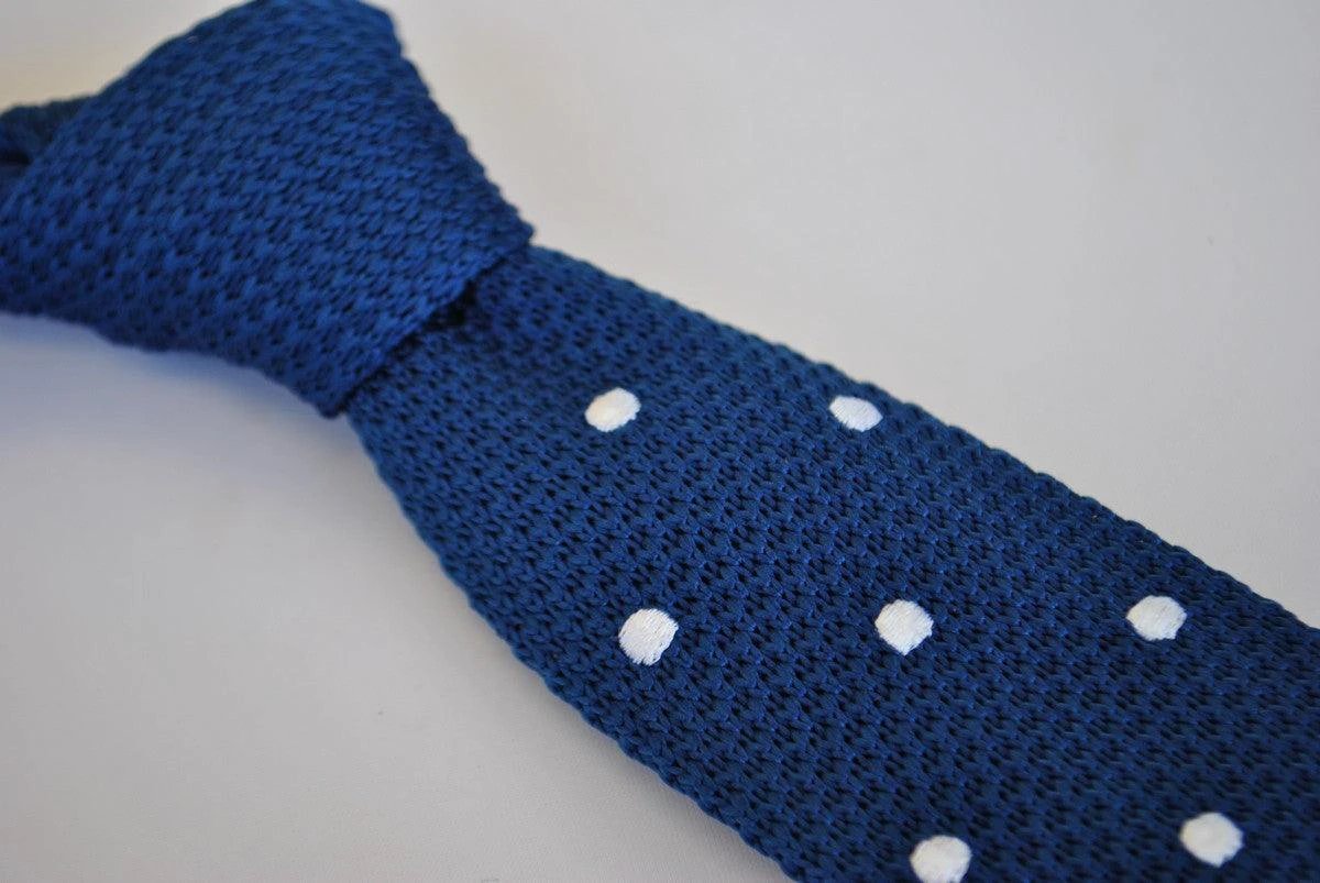 navy blue skinny knitted tie with white polka dots and pointed end by Frederick Thomas Handmade Mens Ties