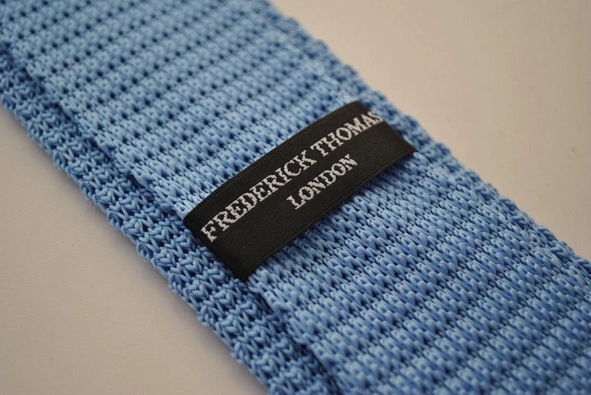 light blue skinny knitted tie with dark blue polka dots by Frederick Thomas Handmade Mens Ties