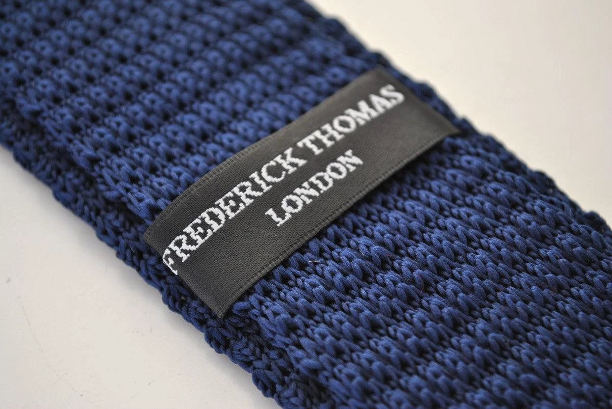 navy blue skinny knitted tie with white polka dots by Frederick Thomas Handmade Mens Ties