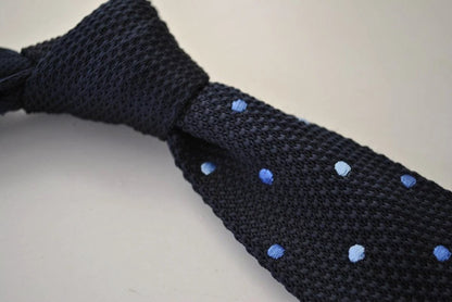 navy blue skinny knitted tie with light blue polka dots by Frederick Thomas Handmade Mens Ties
