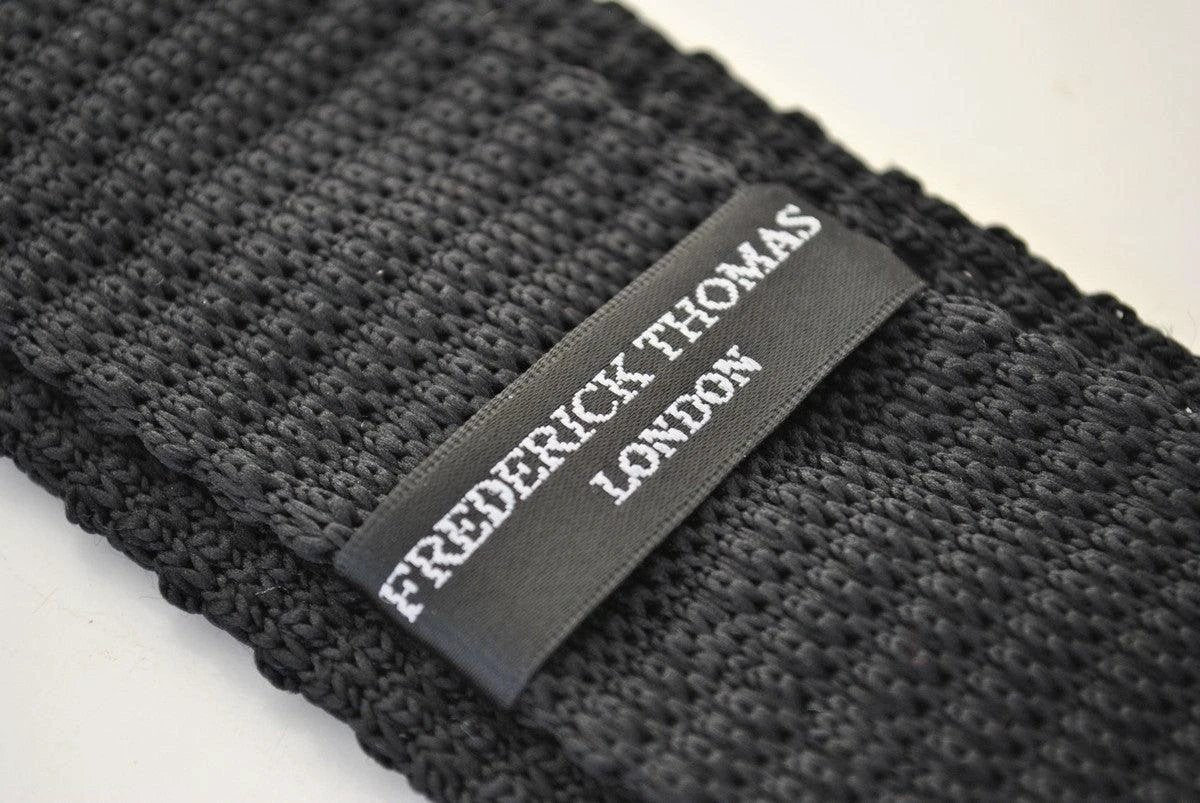 black skinny knitted tie with white polka dots by Frederick Thomas Handmade Mens Ties