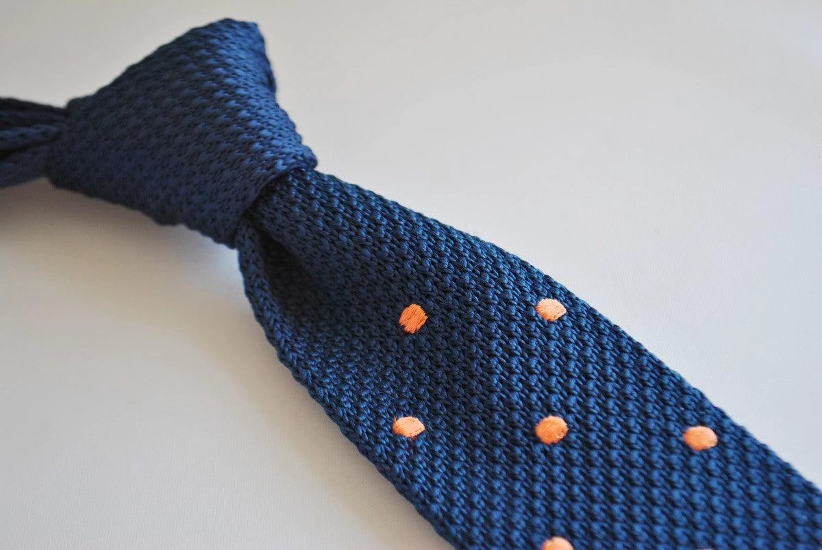 navy blue skinny knitted tie with orange polka dots by Frederick Thomas Handmade Mens Ties