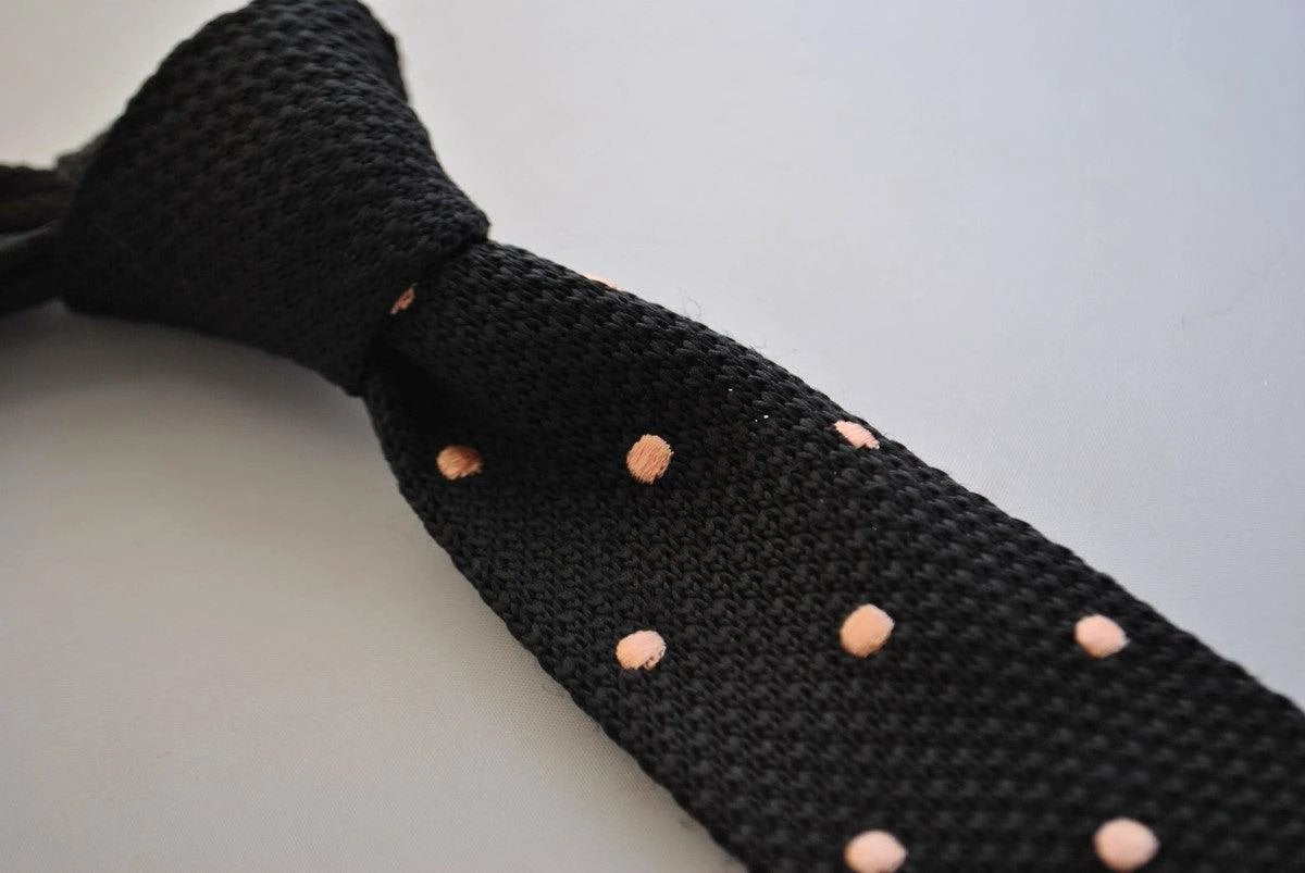 black skinny knitted tie with light blush pink polka dots by Frederick Thomas Handmade Mens Ties