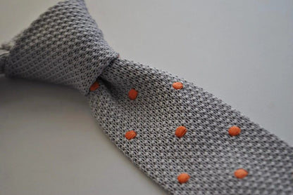grey skinny knitted tie with orange polka dots by Frederick Thomas Handmade Mens Ties