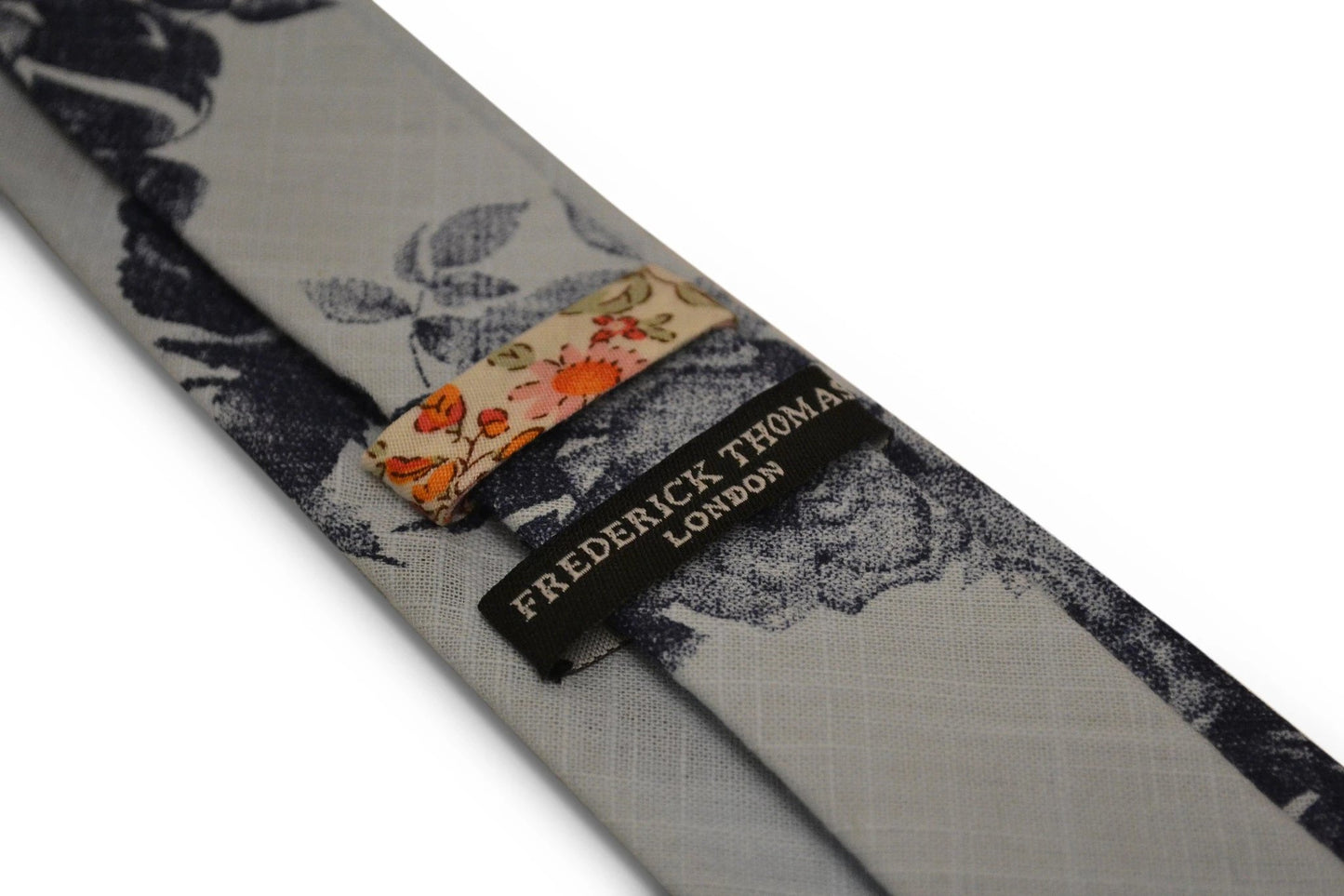 light baby blue with navy blue floral stencil design cotton tie by Frederick Thomas Handmade Mens Ties