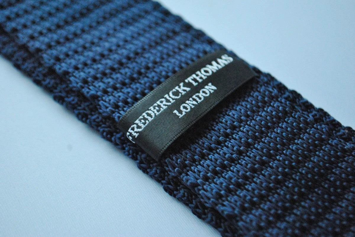 navy blue skinny knitted tie with bright pink polka dots by Frederick Thomas Handmade Mens Ties